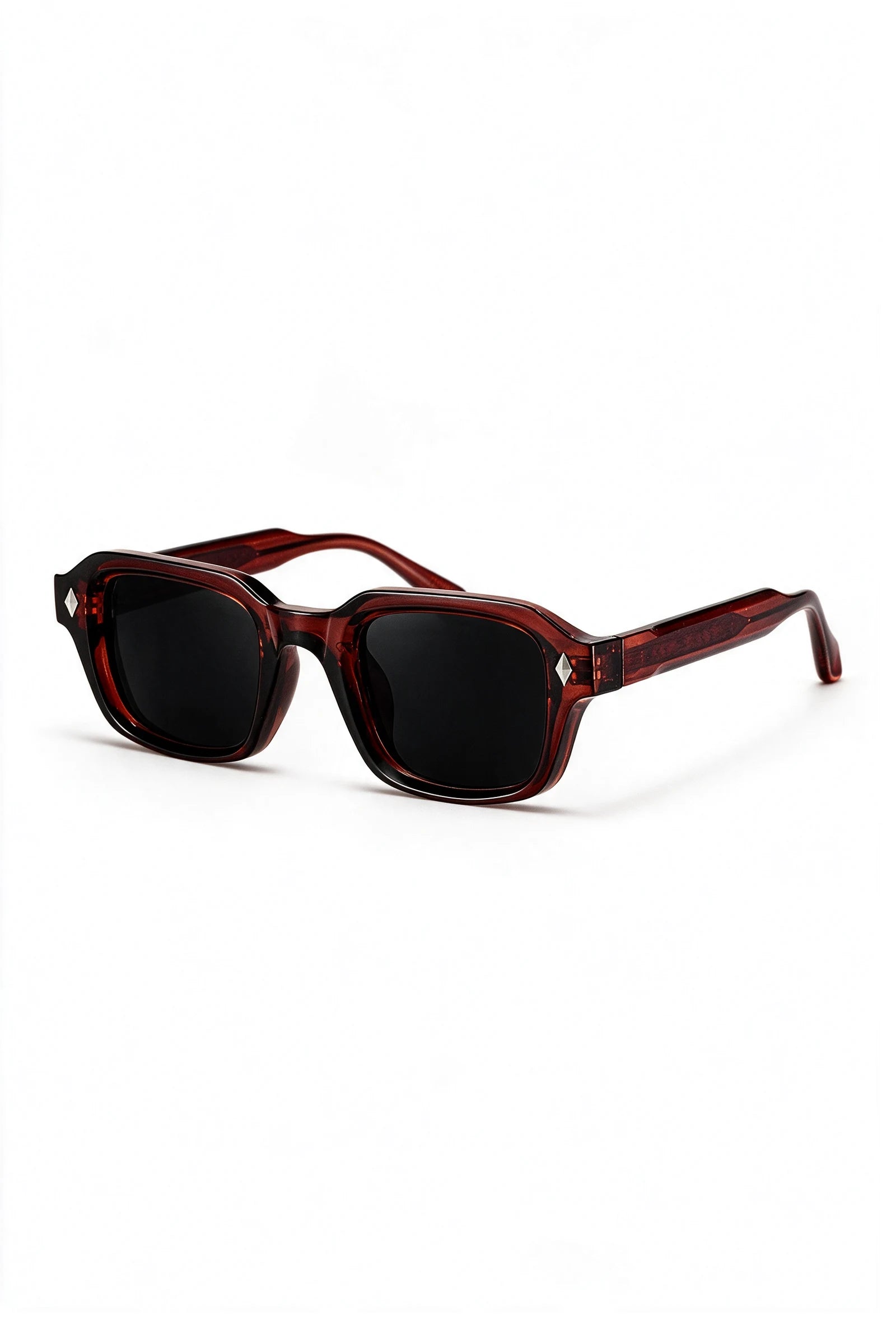 VELA Oxblood sunglasses three-quarter view showing the oxblood temple arm and silver diamond stud