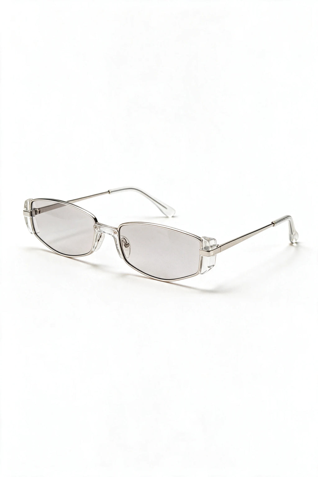 NEVA sunglasses in silver and clear crystal acetate, three-quarter view with temples open