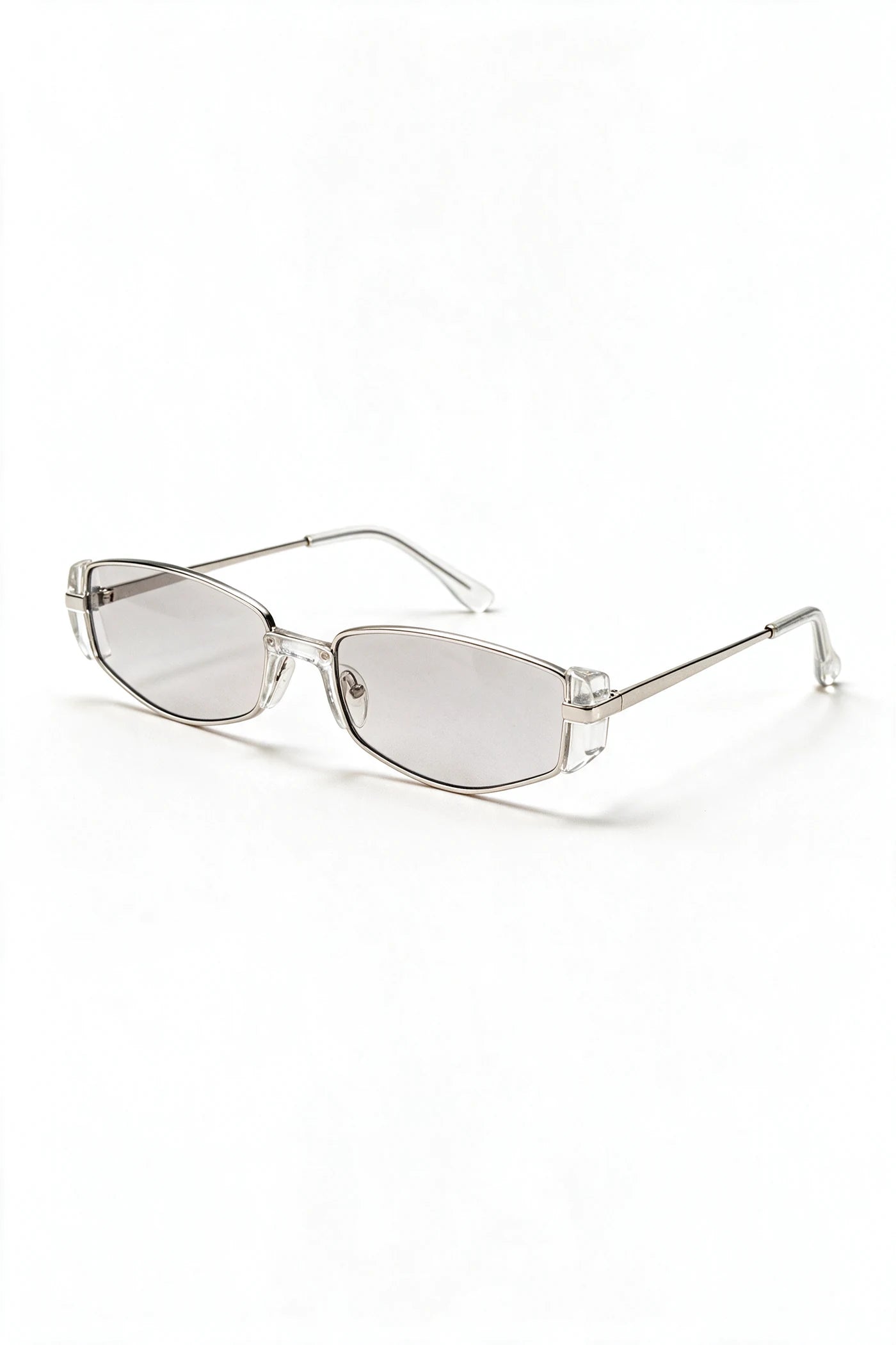 NEVA sunglasses in silver and clear crystal acetate, three-quarter view with temples open