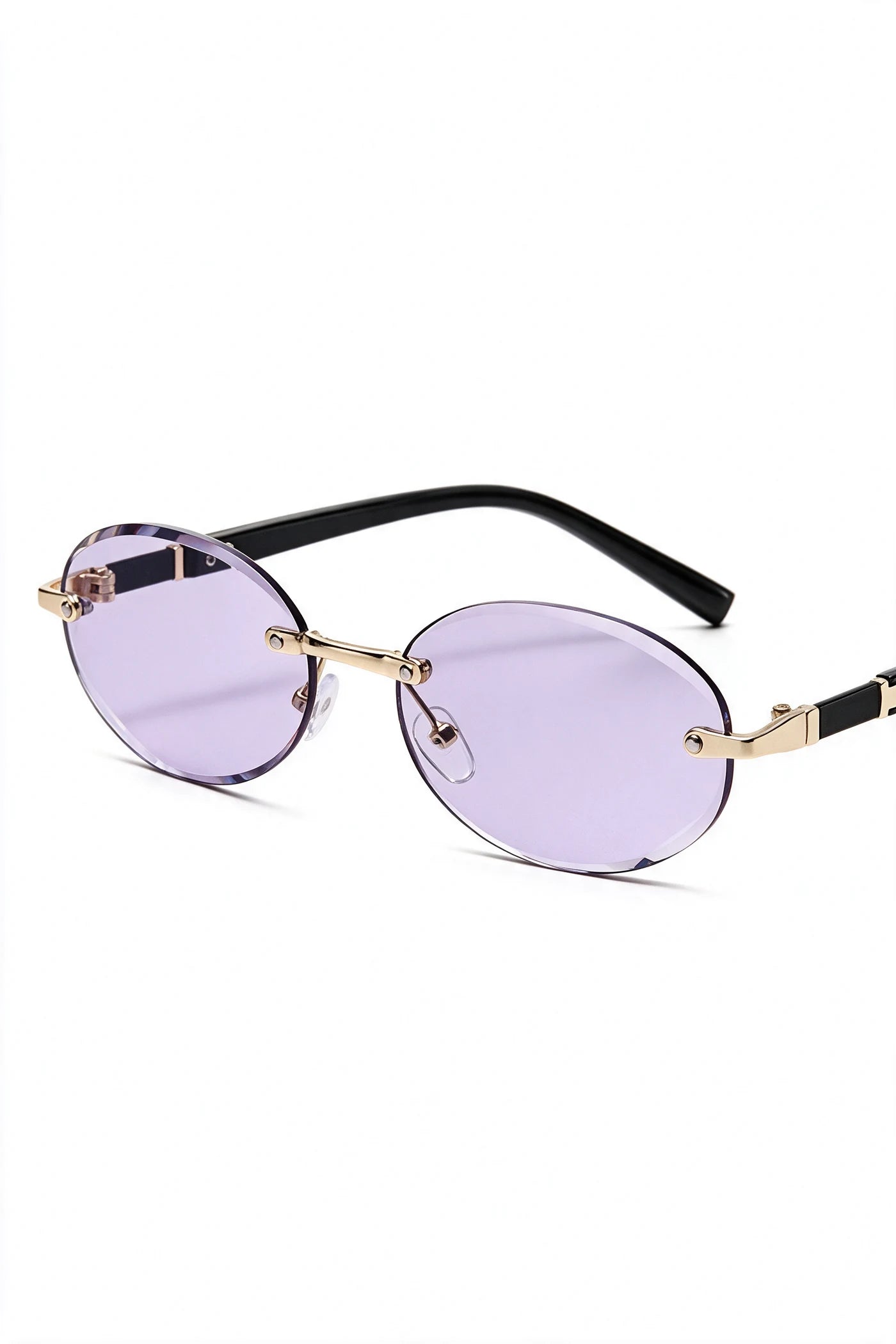 SERA rimless oval sunglasses in pale lilac, three-quarter view with temples open